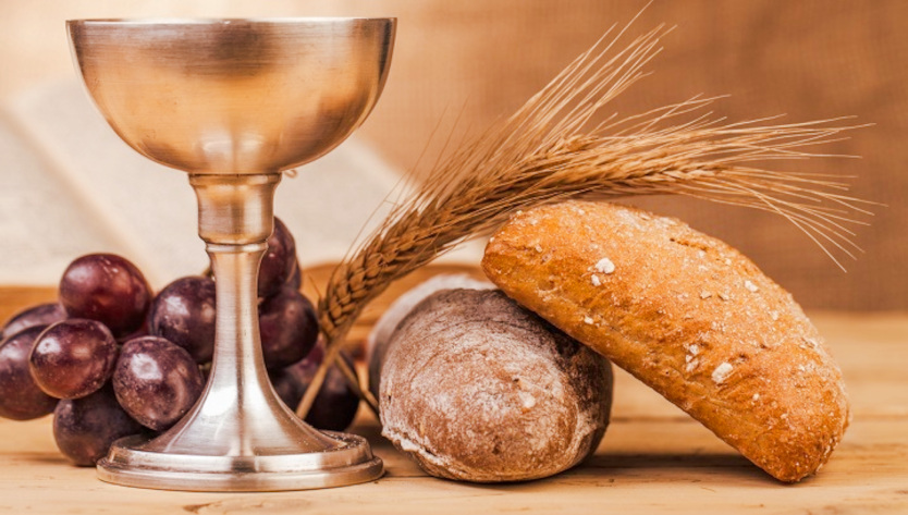 Gesù distribuisce prima il vino e poi il pane